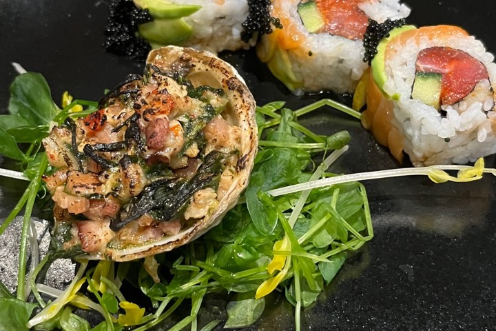 a pan filled with meat and vegetables