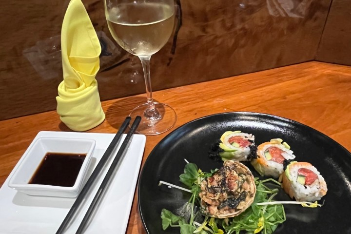 a plate of food with a glass of wine