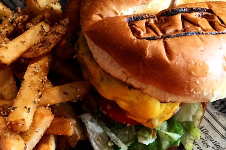 a close up of a sandwich and fries on a plate