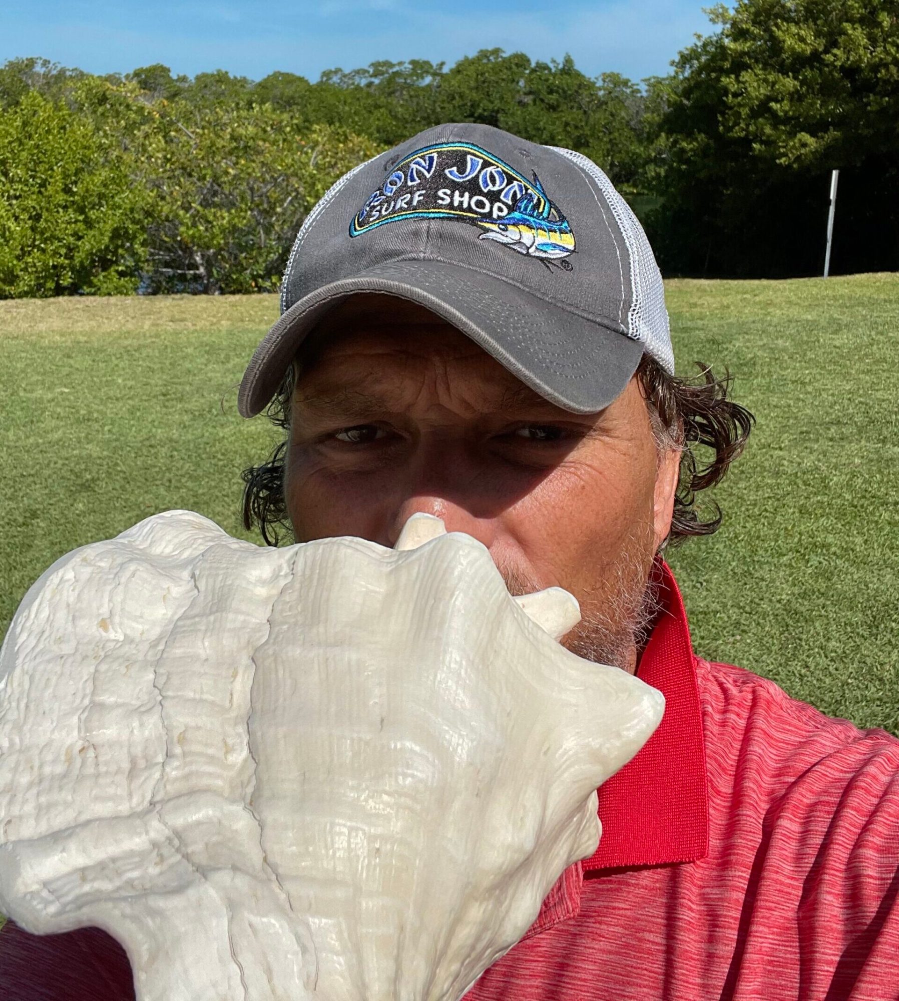 Photo Apr 01, 10 56 23 AM Craig holding Conch shell
