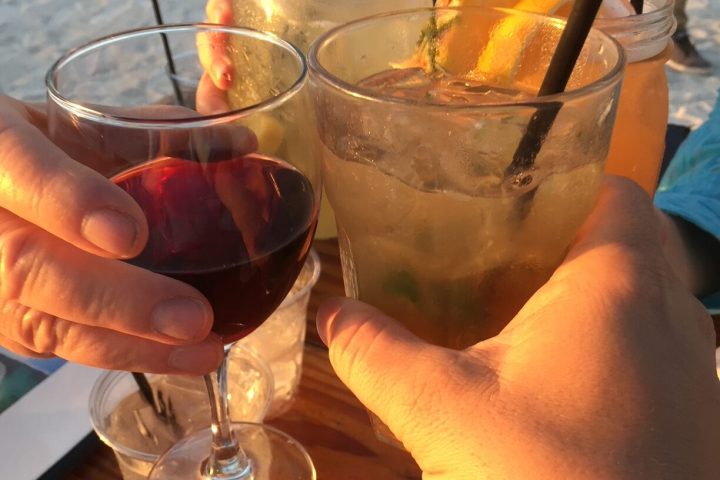 a group of people sitting at a table with wine glasses