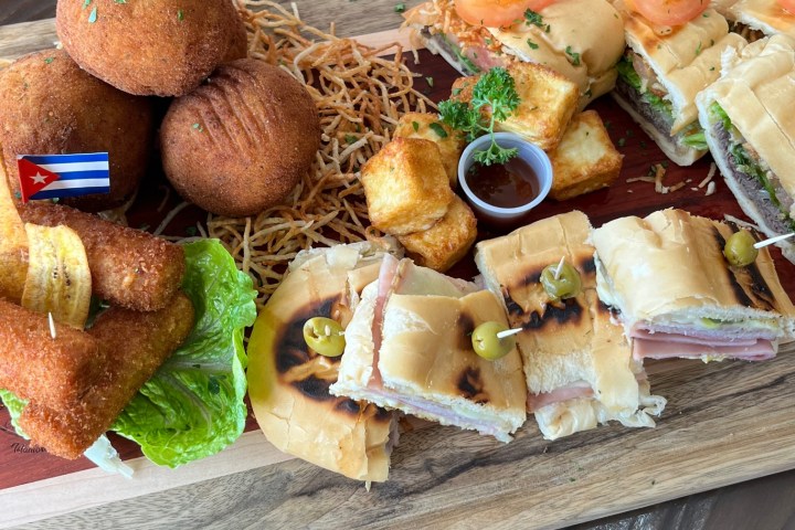a sandwich sitting on top of a wooden table