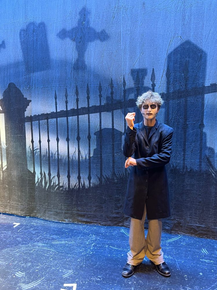 a person standing next to a body of water