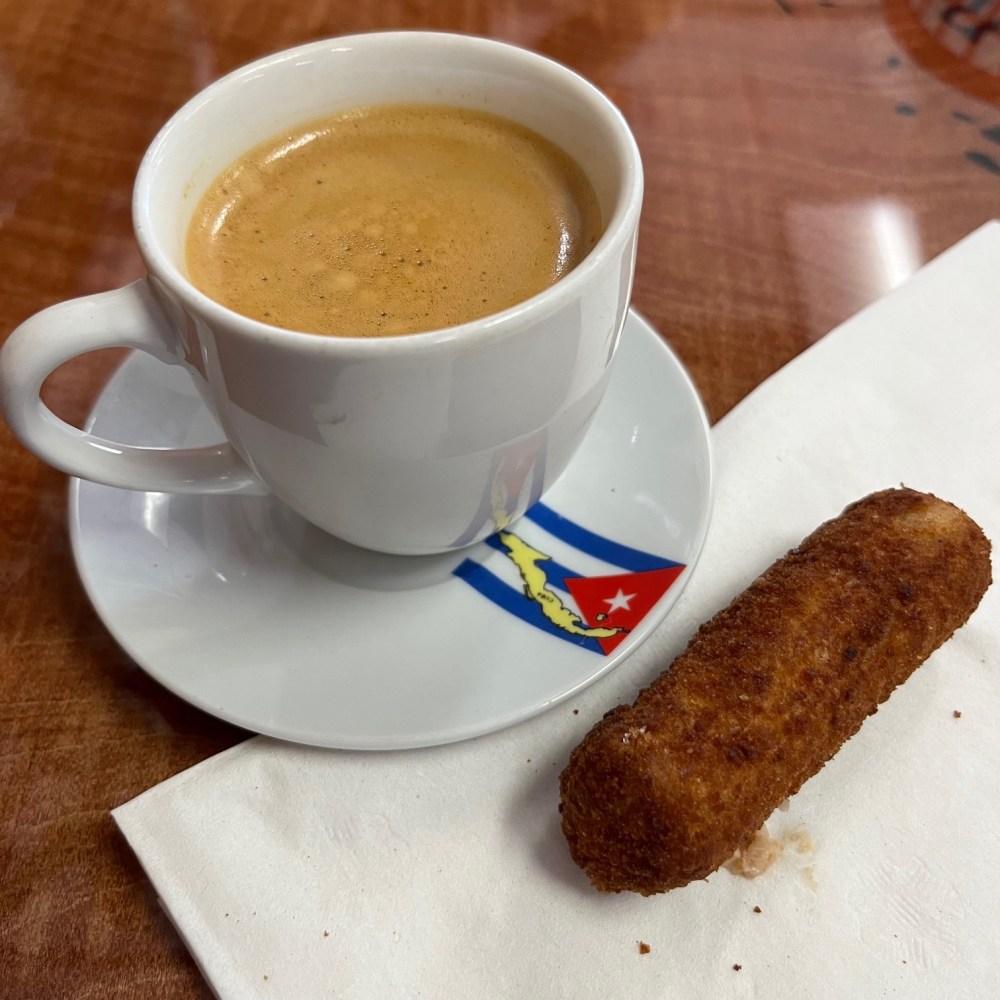 a cup of cuban coffee - a colada, with a croquette form Denny's Latin Cafe on the Florida Keys Food Tour