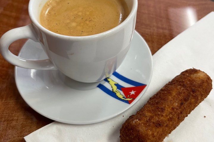 a cup of cuban coffee - a colada, with a croquette form Denny's Latin Cafe on the Florida Keys Food Tour