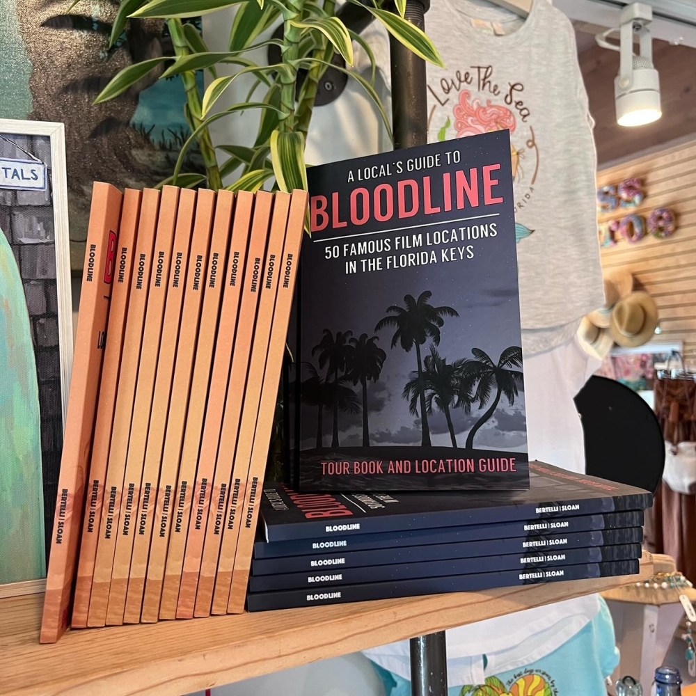 Books titled 'A Local's Guide to Bloodline' displayed at Miss Monroe Boutique