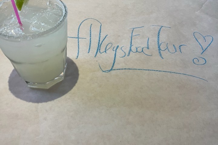 Margarita on the rocks with a lime and slkeys food tour written on the table