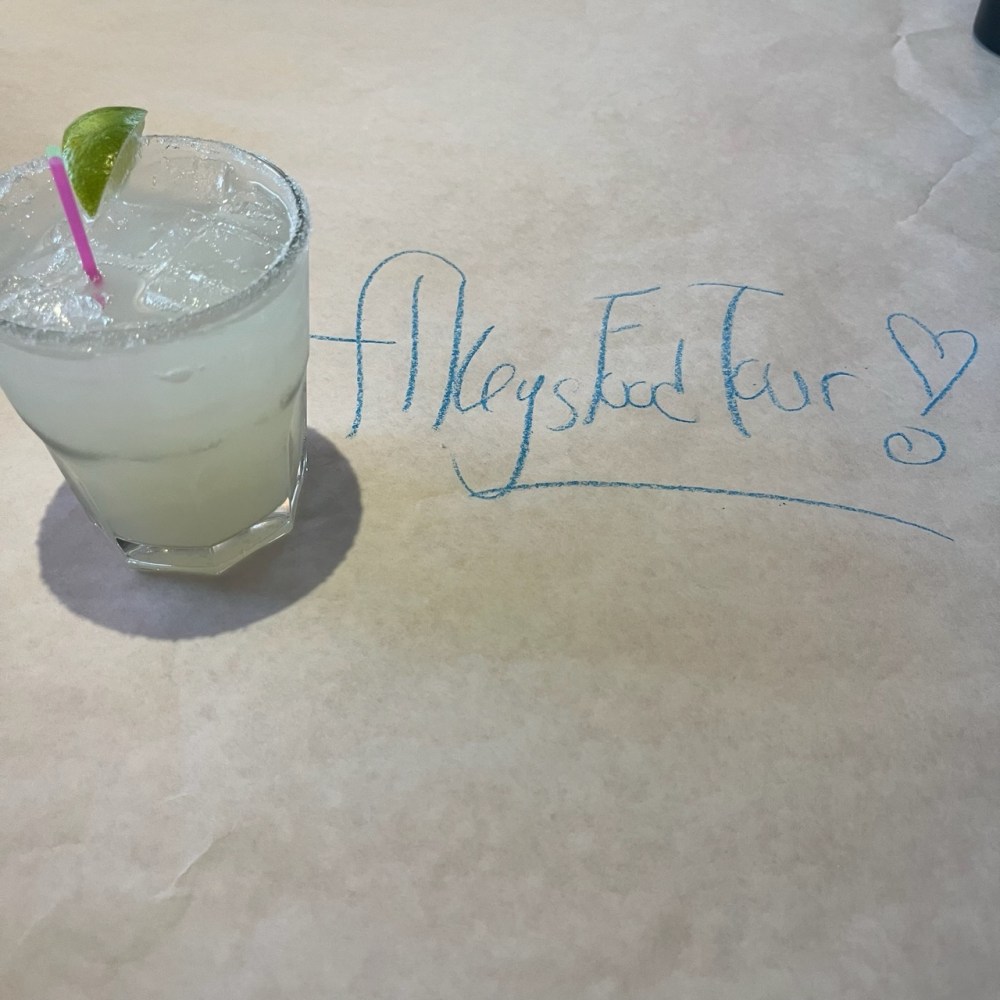 Margarita on the rocks with a lime and slkeys food tour written on the table